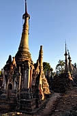 Inle Lake Myanmar. Indein, on the summit of a hill the  Shwe Inn Thein Paya a cluster of hundreds of ancient stupas. Many of them are ruined and overgrown with bushes. 